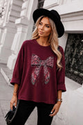 Pull oversize nœud léopard strass